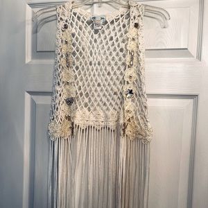 Unique crocheted vest with fringe.